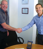 Comtest product specialist Gary Casper (left) who will spearhead sales and marketing for the new AFL agency, shakes hands with Nick Cole, AFLs regional sales manager (SA).